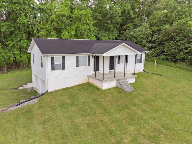 1368 Pleasant Hill Rd, Lynchburg, TN 37352 - single story home featuring a porch, an attached garage, a front lawn, and roof with shingles