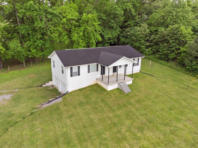 1368 Pleasant Hill Rd, Lynchburg, TN 37352 - view of front facade featuring a front lawn, roof with shingles, and an attached garage