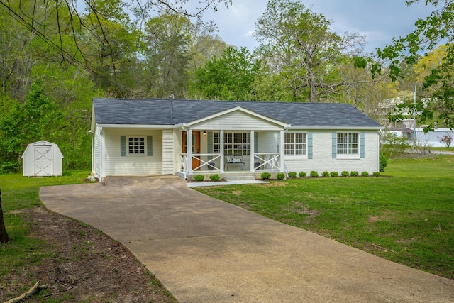 9039 Dallas Hollow Rd, Soddy Daisy, TN 37379 - ranch-style house with covered porch, a front yard, concrete driveway, a storage shed, and an outbuilding