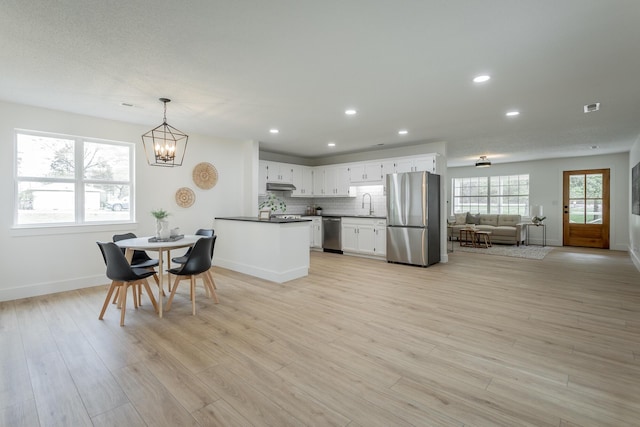 9039 Dallas Hollow Rd, Soddy Daisy, TN 37379 - dining space featuring a chandelier, baseboards, recessed lighting, and light wood-style floors