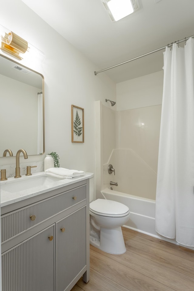 9039 Dallas Hollow Rd, Soddy Daisy, TN 37379 - bathroom with wood finished floors, toilet, shower / tub combo with curtain, and vanity