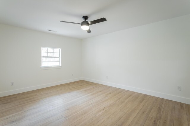 9039 Dallas Hollow Rd, Soddy Daisy, TN 37379 - unfurnished room featuring a ceiling fan, baseboards, and light wood-style flooring