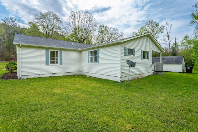 9039 Dallas Hollow Rd, Soddy Daisy, TN 37379 - back of house with crawl space, central AC, a lawn, an outdoor structure, and a storage unit