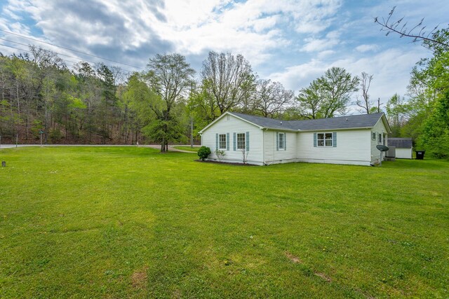 9039 Dallas Hollow Rd, Soddy Daisy, TN 37379 - view of home's exterior featuring a yard, crawl space, and roof with shingles
