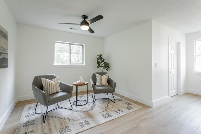 9039 Dallas Hollow Rd, Soddy Daisy, TN 37379 - living area featuring wood finished floors, plenty of natural light, a ceiling fan, and baseboards