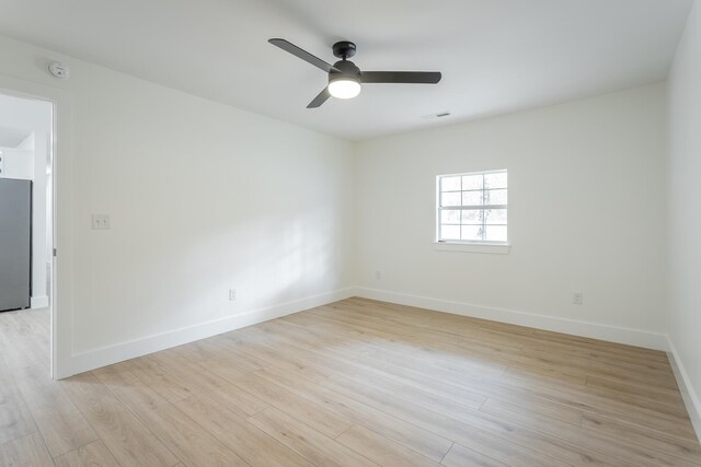 9039 Dallas Hollow Rd, Soddy Daisy, TN 37379 - empty room with a ceiling fan, baseboards, light wood-style flooring, and a smoke detector