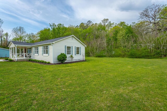 9039 Dallas Hollow Rd, Soddy Daisy, TN 37379 - view of property exterior with a lawn and covered porch