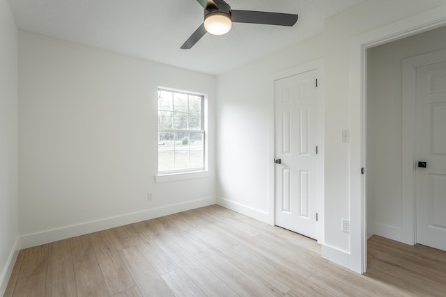 9039 Dallas Hollow Rd, Soddy Daisy, TN 37379 - unfurnished bedroom with light wood-type flooring, baseboards, and a ceiling fan