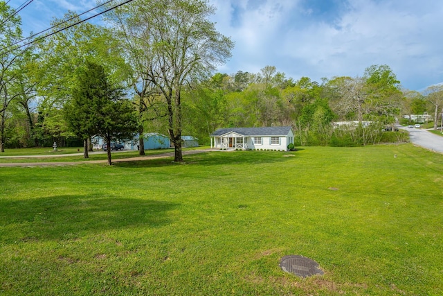 9039 Dallas Hollow Rd, Soddy Daisy, TN 37379 - view of green lawn with a porch