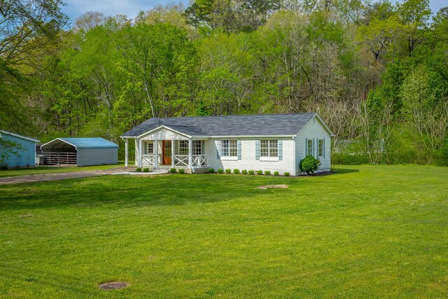 9039 Dallas Hollow Rd, Soddy Daisy, TN 37379 - ranch-style home with a front yard, covered porch, a carport, driveway, and a shingled roof