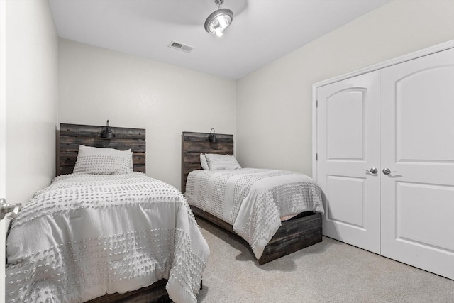 bedroom featuring carpet and a closet