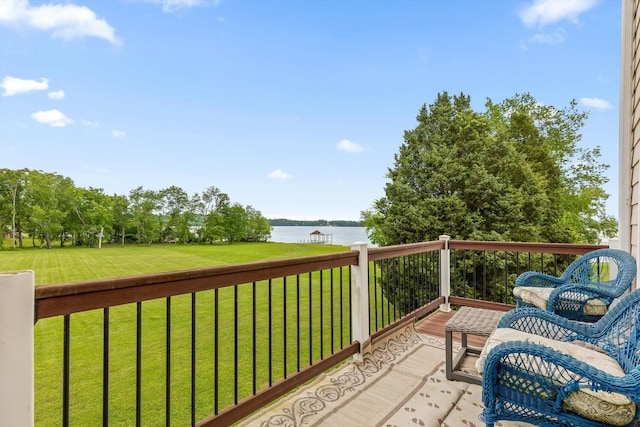balcony featuring a water view