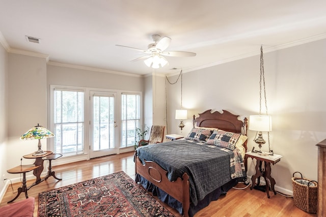 6737 Autumnwood Dr, Nashville, TN 37221 - bedroom with access to outside, wood finished floors, baseboards, and crown molding