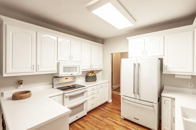 6737 Autumnwood Dr, Nashville, TN 37221 - kitchen featuring white appliances, white cabinets, light countertops, and light wood-type flooring