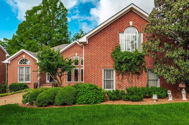 6737 Autumnwood Dr, Nashville, TN 37221 - view of front of property with brick siding and a front lawn