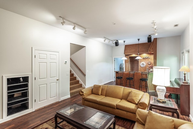 6737 Autumnwood Dr, Nashville, TN 37221 - living area featuring rail lighting, stairway, wood finished floors, and baseboards