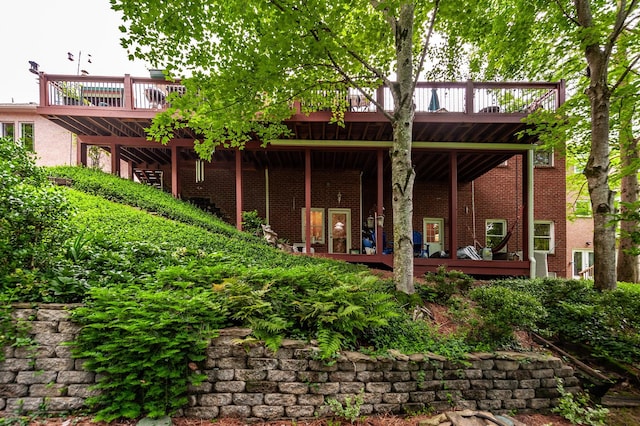 6737 Autumnwood Dr, Nashville, TN 37221 - rear view of property with a deck and brick siding