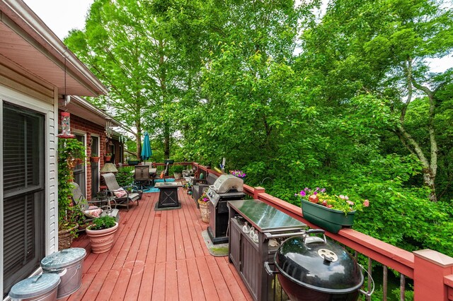 6737 Autumnwood Dr, Nashville, TN 37221 - wooden deck featuring a fire pit