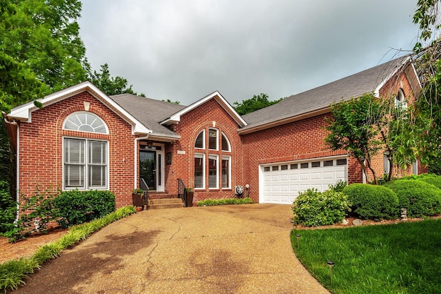 6737 Autumnwood Dr, Nashville, TN 37221 - traditional home with brick siding, driveway, and a shingled roof