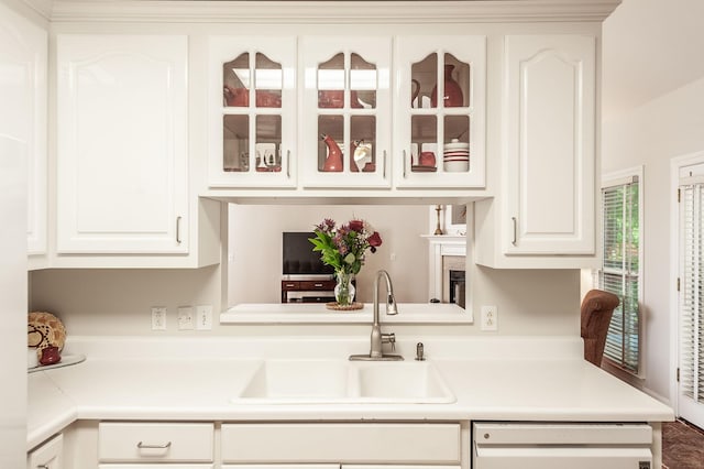 6737 Autumnwood Dr, Nashville, TN 37221 - kitchen featuring a sink, dishwasher, white cabinets, and glass insert cabinets