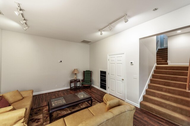 6737 Autumnwood Dr, Nashville, TN 37221 - living room with track lighting, stairs, wood finished floors, and baseboards