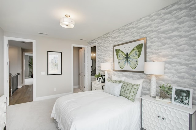 5969 Hunt Valley Dr, Spring Hill, TN 37174 - carpeted bedroom featuring baseboards, wallpapered walls, and an accent wall