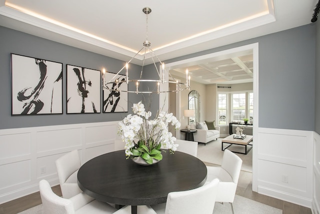 5969 Hunt Valley Dr, Spring Hill, TN 37174 - dining area featuring coffered ceiling, a decorative wall, a chandelier, a tray ceiling, and wainscoting