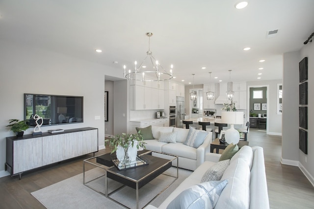 5969 Hunt Valley Dr, Spring Hill, TN 37174 - living room with a chandelier, baseboards, wood finished floors, and recessed lighting