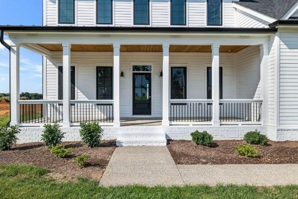 1941 Harmony Rd, Spring Hill, TN 37174 - doorway to property featuring a porch