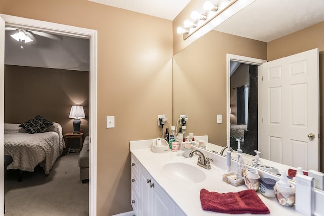 full bathroom featuring connected bathroom, vanity, and ceiling fan