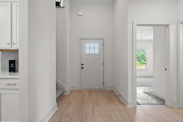 178 Dewberry Ct, Clarksville, TN 37042 - foyer entrance featuring light wood-style floors, baseboards, and stairway