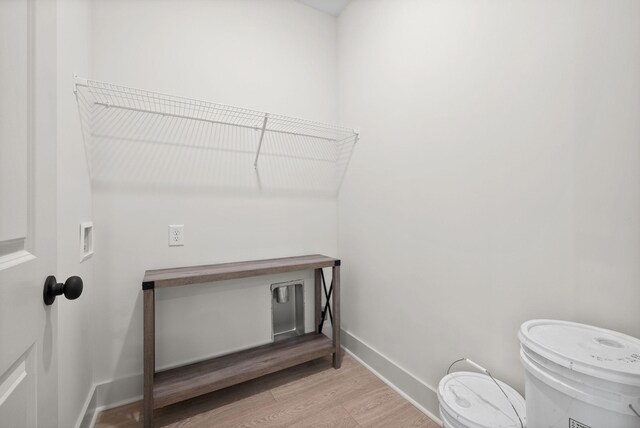 178 Dewberry Ct, Clarksville, TN 37042 - laundry room with light wood-style flooring, hookup for a washing machine, and baseboards