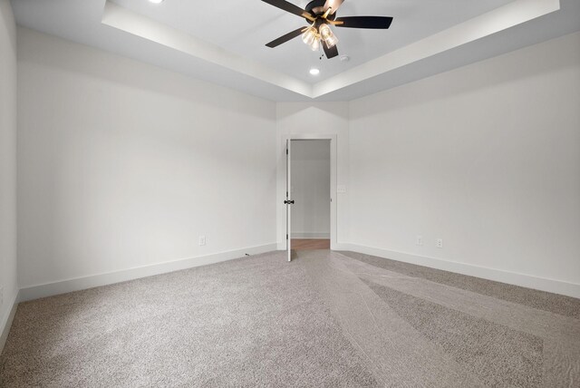 178 Dewberry Ct, Clarksville, TN 37042 - empty room with a tray ceiling, baseboards, recessed lighting, a ceiling fan, and light colored carpet