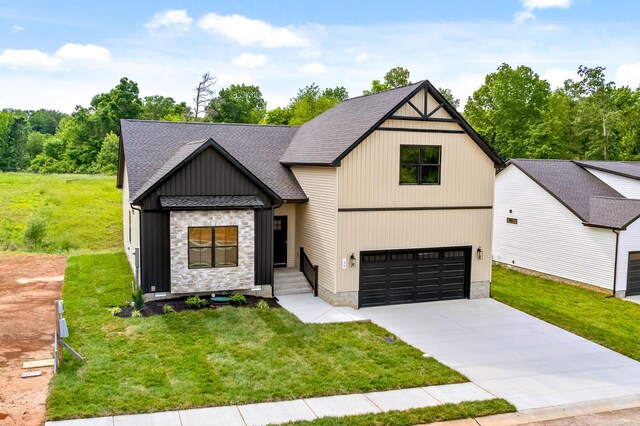 178 Dewberry Ct, Clarksville, TN 37042 - modern farmhouse with a front yard, an attached garage, roof with shingles, and concrete driveway