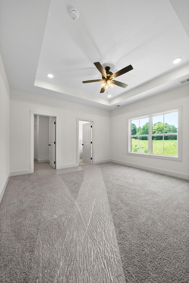 178 Dewberry Ct, Clarksville, TN 37042 - empty room featuring a raised ceiling, light carpet, baseboards, ceiling fan, and recessed lighting