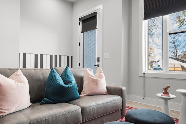 living area featuring wood finished floors and baseboards