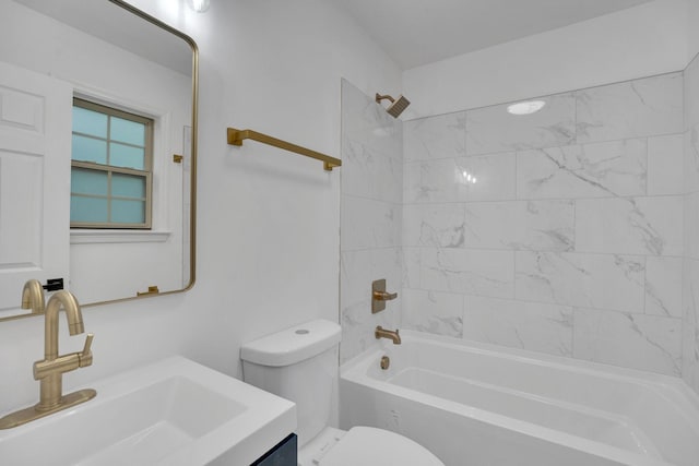 bathroom featuring toilet, shower / tub combination, and vanity