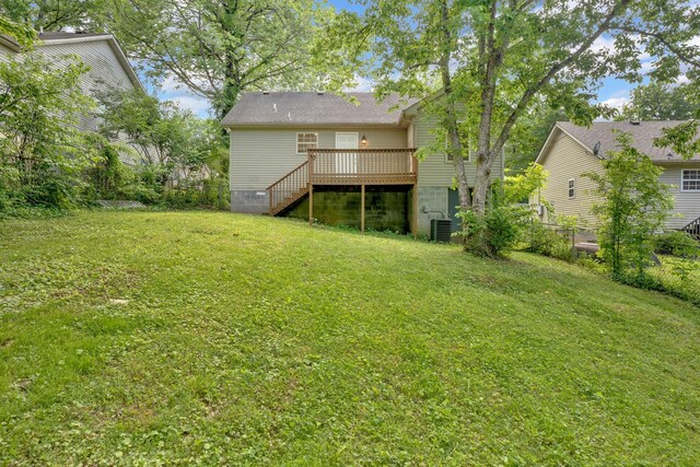 back of property with a deck, stairs, and central AC unit