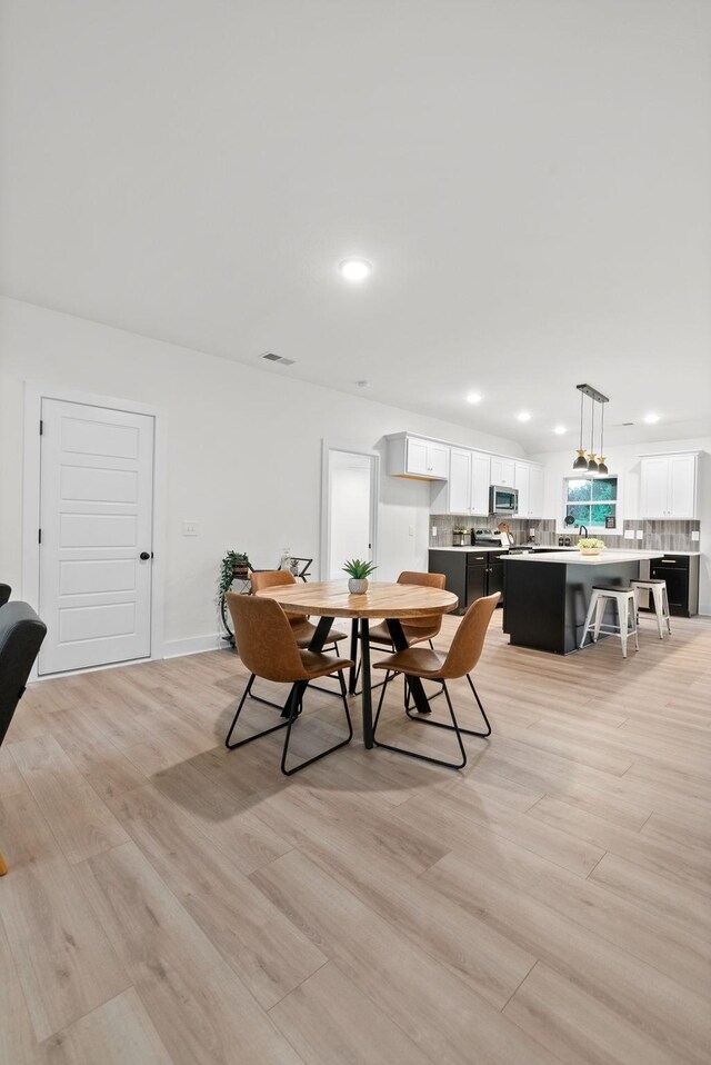 182 Dewberry Ct, Clarksville, TN 37042 - dining area with light wood-style floors and recessed lighting