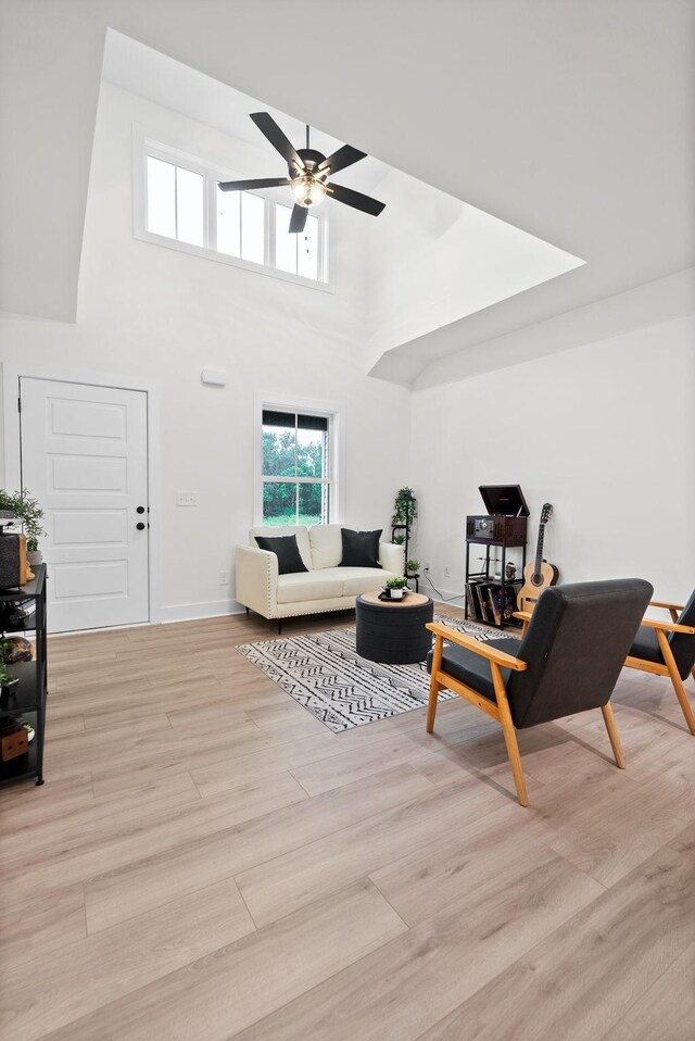 182 Dewberry Ct, Clarksville, TN 37042 - living area with ceiling fan, light wood-type flooring, a high ceiling, and baseboards