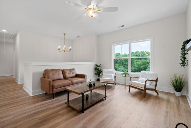 186 Dewberry Ct, Clarksville, TN 37042 - living room with attic access, light wood-style flooring, baseboards, a ceiling fan, and recessed lighting