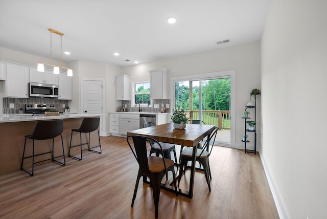 186 Dewberry Ct, Clarksville, TN 37042 - dining area with light wood-style floors and recessed lighting