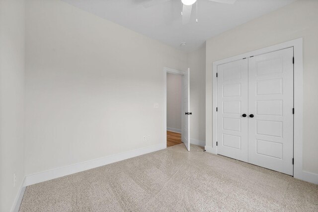 186 Dewberry Ct, Clarksville, TN 37042 - unfurnished bedroom with carpet, a closet, baseboards, and a ceiling fan