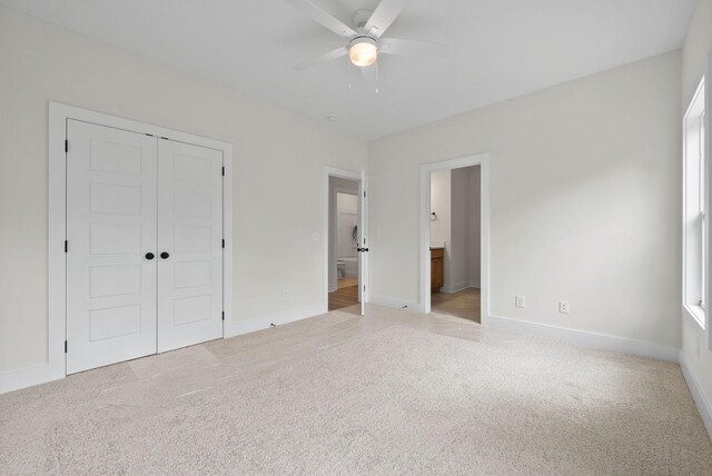 186 Dewberry Ct, Clarksville, TN 37042 - unfurnished bedroom with carpet flooring, a closet, baseboards, and connected bathroom