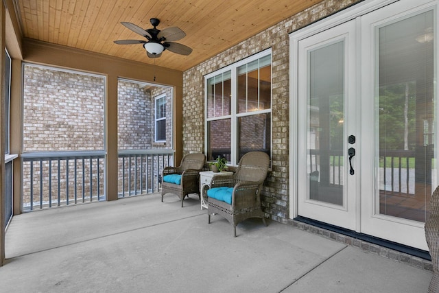 sunroom with ceiling fan, french doors, and plenty of natural light