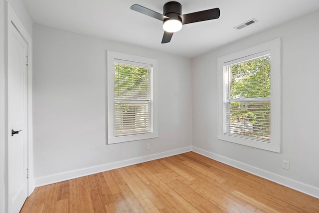 empty room with light wood-type flooring, baseboards, and ceiling fan