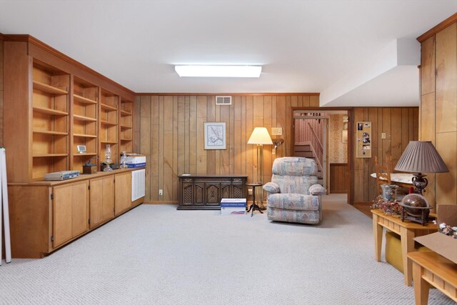 1326 Holly Tree Gap Rd, Brentwood, TN 37027 - living area featuring wooden walls, stairs, and light carpet