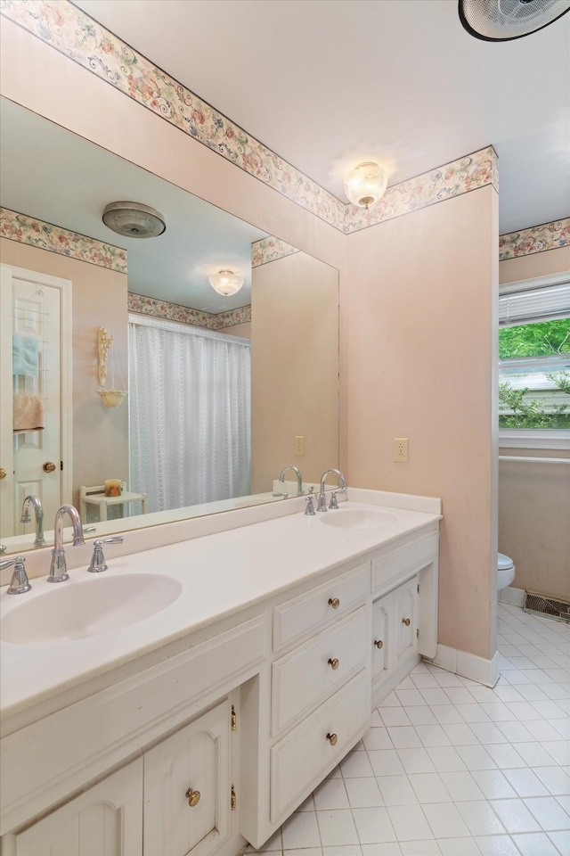 1326 Holly Tree Gap Rd, Brentwood, TN 37027 - bathroom featuring toilet, double vanity, tile patterned flooring, a shower with shower curtain, and baseboards