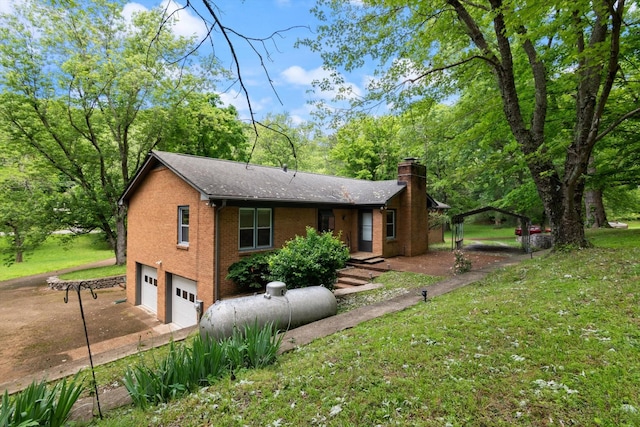 1326 Holly Tree Gap Rd, Brentwood, TN 37027 - view of front of home with a chimney, a garage, brick siding, and a front yard