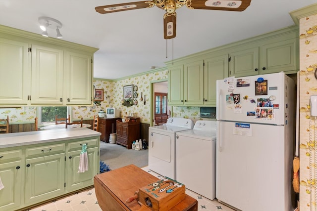 1326 Holly Tree Gap Rd, Brentwood, TN 37027 - kitchen with freestanding refrigerator, washing machine and clothes dryer, wallpapered walls, a ceiling fan, and green cabinets